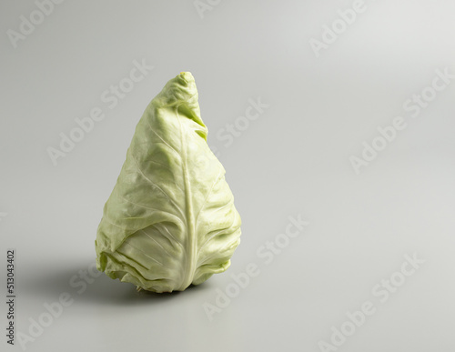 Cone head cabbage for dietary, vegan on a grey background, restaurant concept
