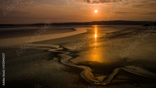 A drone aerial shot of the sunset over Silverdale Morecambe Bay which is notorious for quicksand