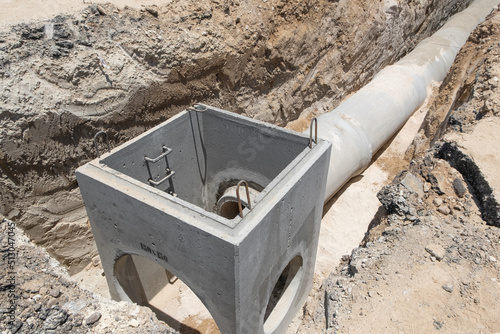 Принти на полотні Laying sewer Concrete drainage pipe between large residential areas