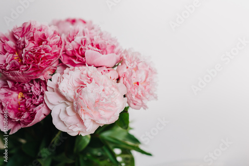 Fototapeta Naklejka Na Ścianę i Meble -  Beautiful bouquet of pink pastel peony flowers on a white background.