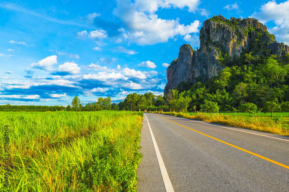 Φωτογραφία Country road along the farm and limestone mountain at the roadside, travel sceni