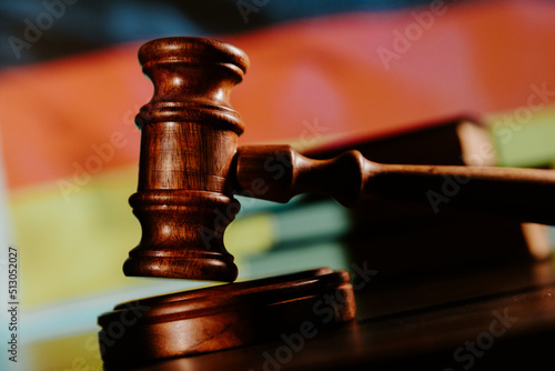 Judge gavel close-up and flag of Germany. Law of Germany concept. Violation of rights photo