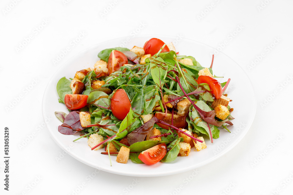 Arugula and breadcrumbs salad on a white background