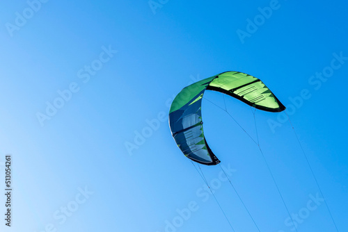 wing of kitesurfing against the blue sky . Kitesurfing on the sea 