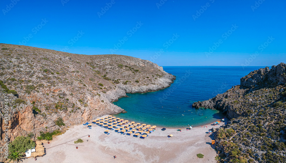 Aerial panoramic view of the famous rocky beach Chalkos in Kythira island at sunset. Amazing scenery with crystal clear water and a small rocky gulf, Mediterranean sea, Greece, Europe.
