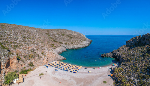 Aerial panoramic view of the famous rocky beach Chalkos in Kythira island at sunset. Amazing scenery with crystal clear water and a small rocky gulf  Mediterranean sea  Greece  Europe.