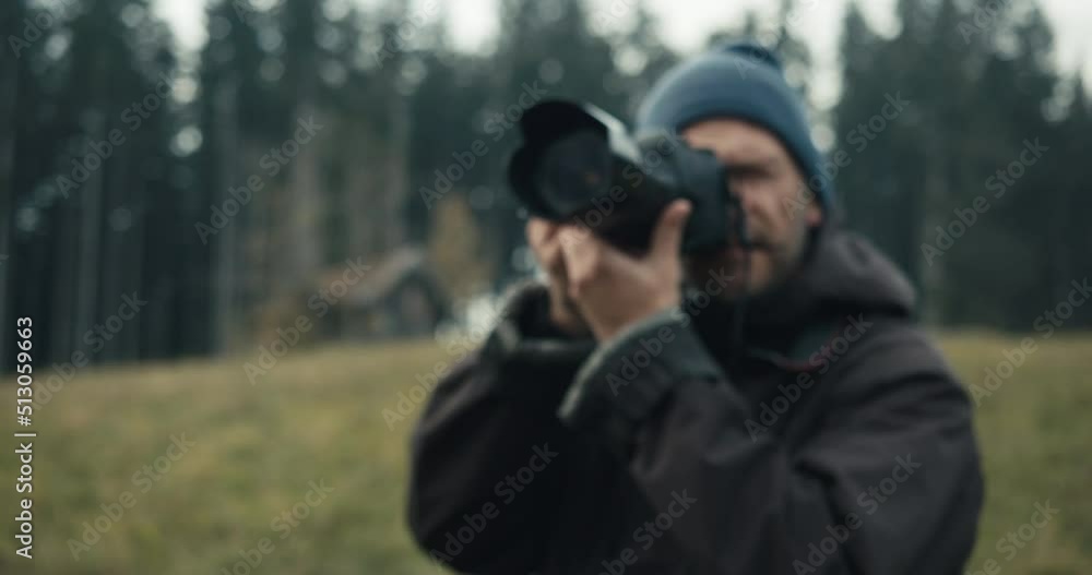 Landscape Photographer taking pictures during a moody autumn day in the hills of Mondsee, Austria Landscape Photographer taking pictures during a moody autumn day in the hills of Mondsee, Austria