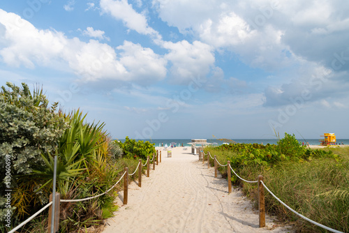 empty pathway road leading to summertime beach