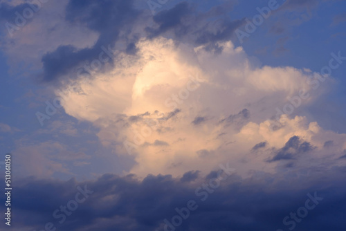 Beautifully lit cloud in the evening blue sky