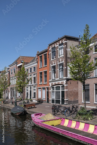 Canal view with old traditional Dutch houses in Leiden on beautiful sunny day. Leiden, North Holland, the Netherlands.