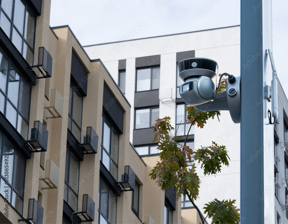 Street security cameras on the background of modern office buildings. Street security cameras on the background of modern office buildings.