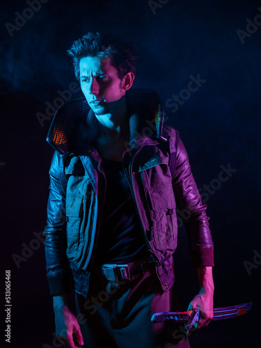 A guy in a cyberpunk image  holding a tuned katana in his hands. A young man in neon lighting on a black background