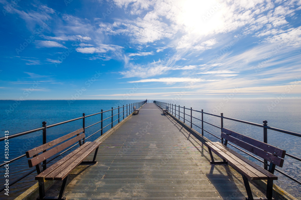 Pier in the sea with a blue sky