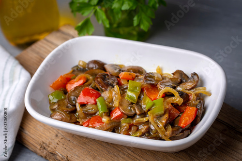 Sauteed mushrooms with onions and peppers. It is eaten as an appetizer with meals. (Turkish name; soslu mantar mezesi)