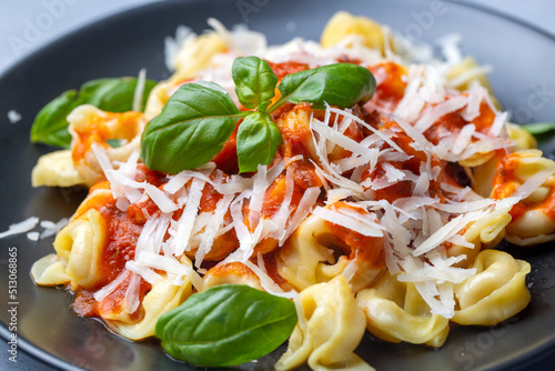 Italian tortellini pasta with tomato sauce - Italian food style photo