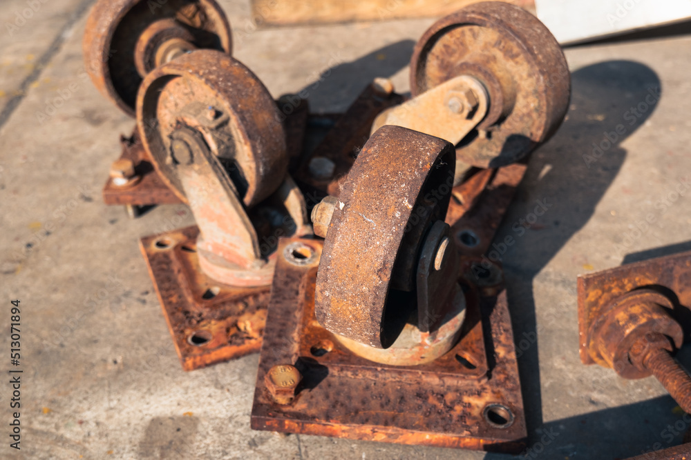 Caster Wheel or Trolley Wheels. rusted old cart wheels