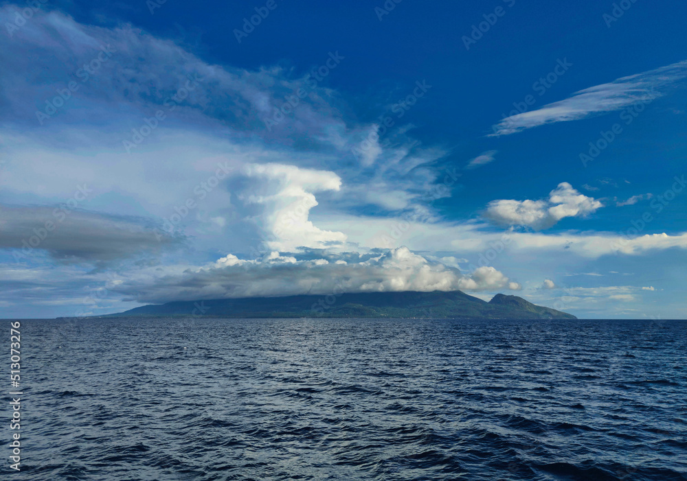 Camiguin Island, under dramatic sky and volcanic island