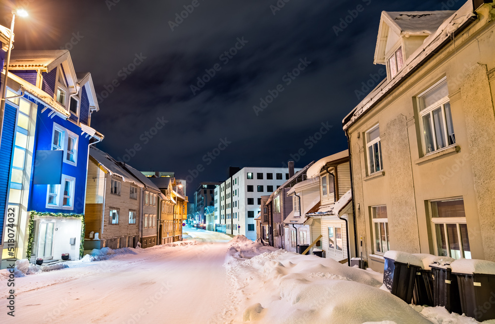 Traditional houses in Tromso at a winter night in Polar Norway