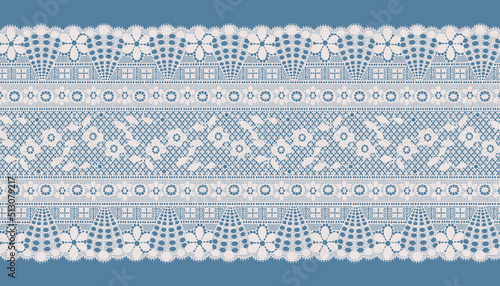 WIDE IVORY SCALLOPED LACE TRIM ON BLUE BACKGROUND