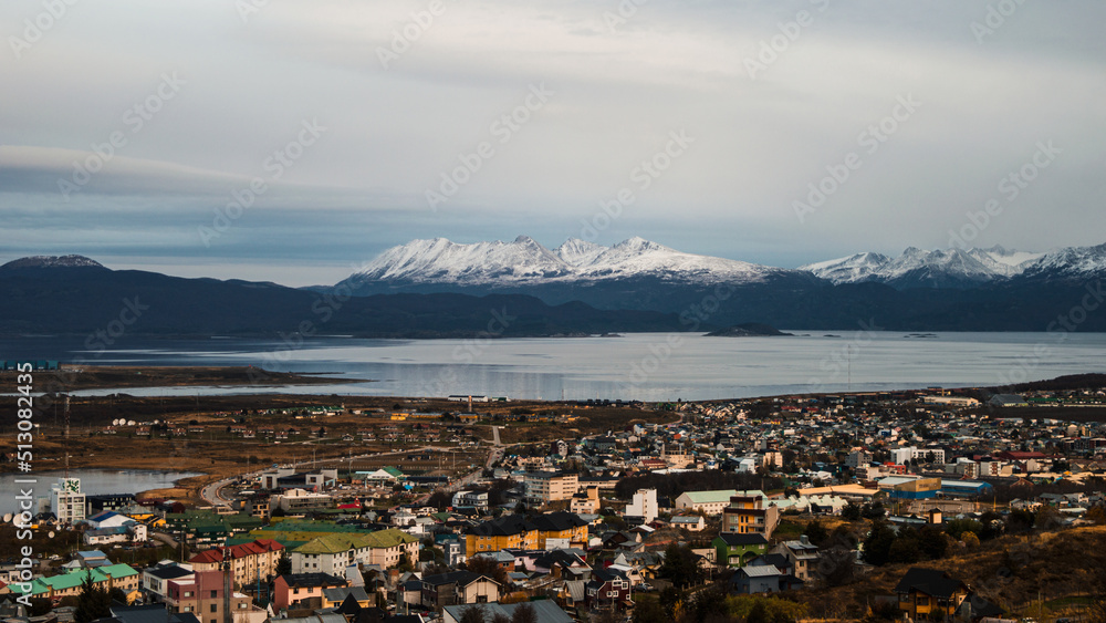 Beagle Channel with the buildings of Ushuaia and its snowy mountains in the background. Tierra del Fuego, Argentina