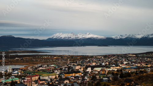 Obraz na płótnie Beagle Channel with the buildings of Ushuaia and its snowy mountains in the background. Tierra del Fuego, Argentina w salonie