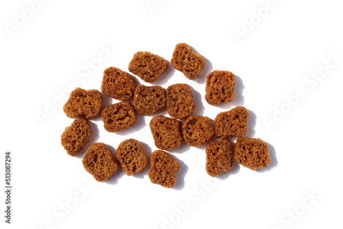 Heap of brown crackers on a white isolated background.