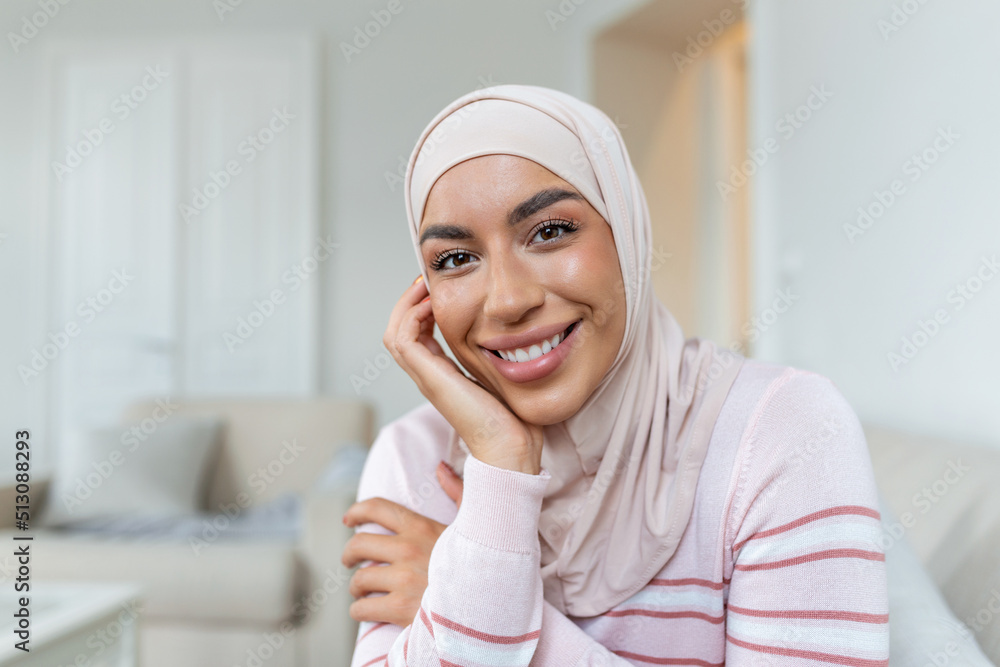 Portrait young muslim woman in headscarf smile.Happy moment concept. Headshot of a beautiful Muslim female model in a casual wear and hijab Portrait young muslim woman in headscarf smile.Happy moment concept. Headshot of a beautiful Muslim female model in a casual wear and hijab