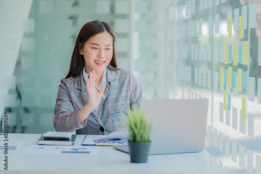 Asian business woman working on laptop computer in her workstation, startup, businessperson, employee, marketing concept, account, online finance, ecommerce, freelance. Asian business woman working on laptop computer in her workstation, startup, businessperson, employee, marketing concept, account, online finance, ecommerce, freelance.