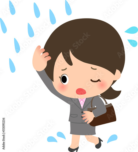 にわか雨に遭って走るスーツの女性