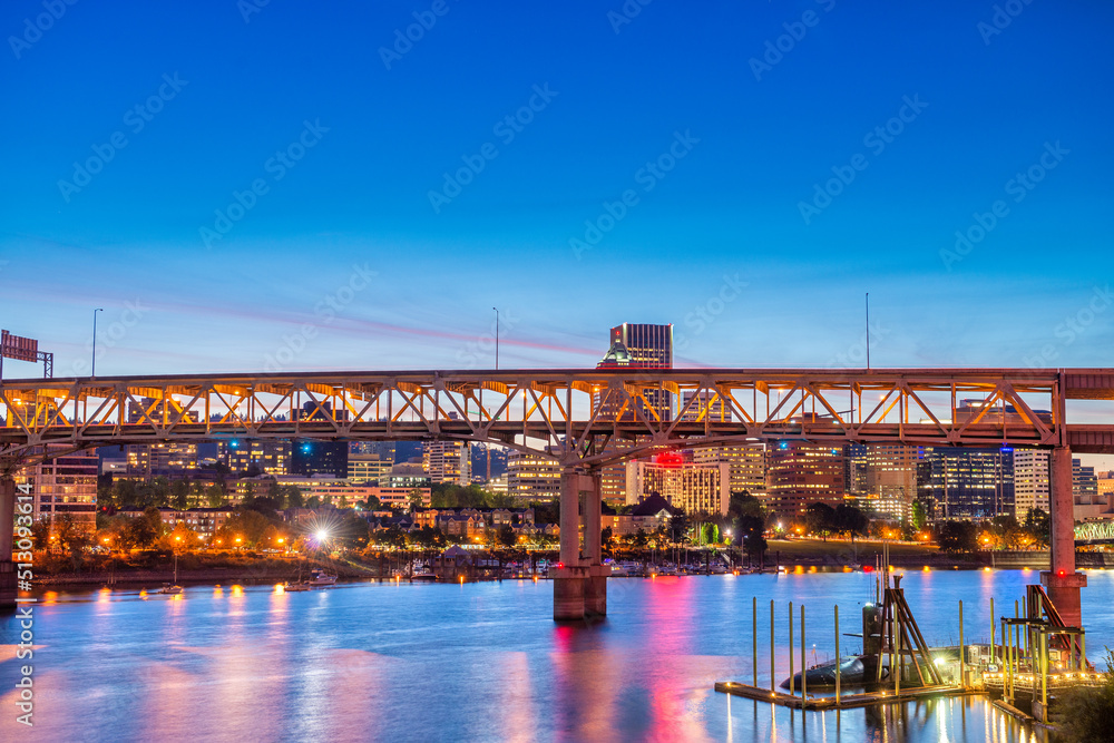 Modern night skyline of Portland with river light reflections, O