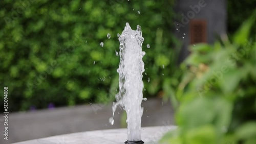 Slow-motion, Fountain splash close-up on a defocused background
