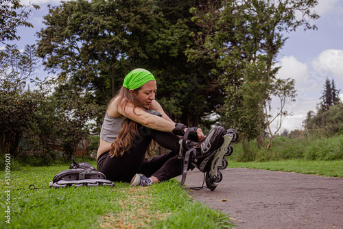 young sporty woman practicing inline skating in an urban setting. High quality photo