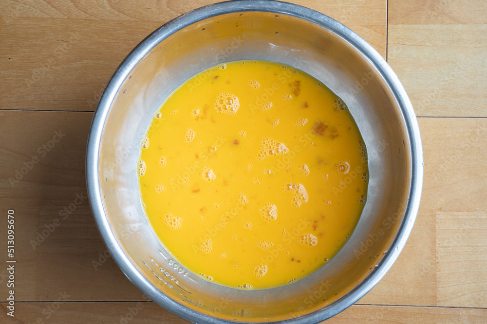 Beaten egg in a bowl Beaten egg in a bowl