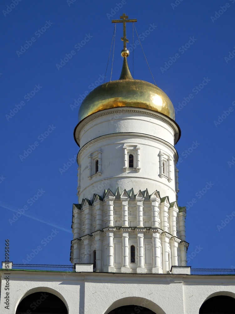 crucifix and dome of yellow gold of metal on top of the building. crucifix and dome of yellow gold of metal on top of the building.