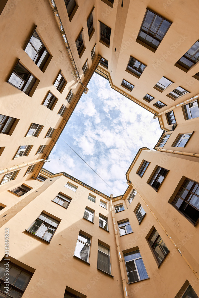 Photograph of sky inside courtyard of well Photograph of sky inside courtyard of well
