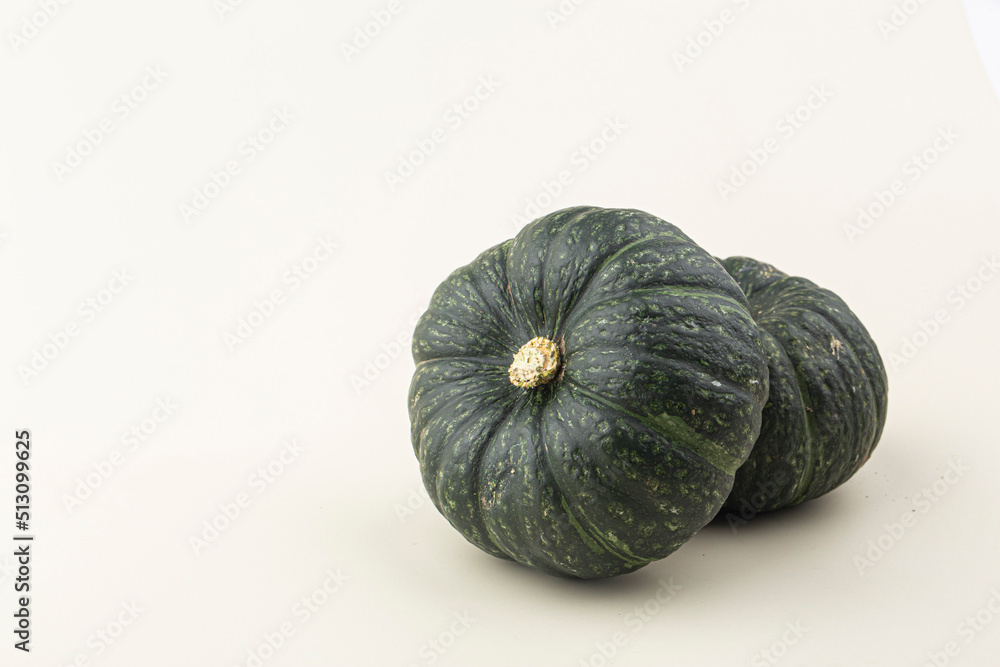 Green mini pumpkin isolated on the white background . Green mini pumpkin isolated on the white background .