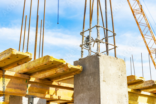 Formwork for pouring the second floor of a monolithic building. Reinforcement of walls and ceiling. Monolithic work during the construction of a building close-up. Construction technologies. photo