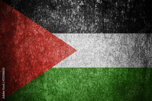 Closeup of grunge Palestinian flag. Dirty Palestine flag on a metal surface