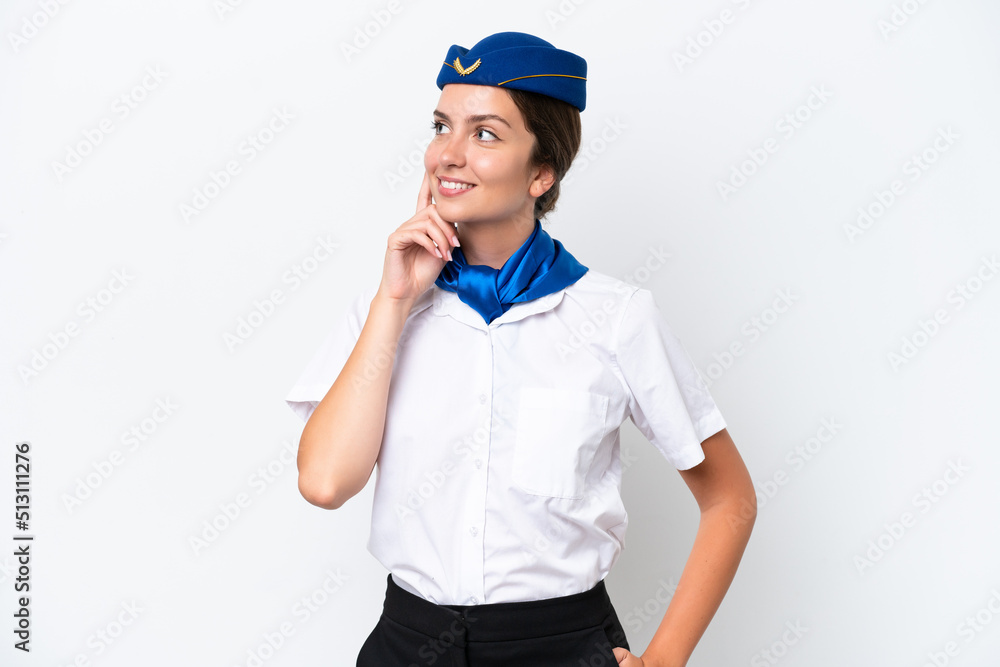 Airplane stewardess caucasian woman isolated on white background thinking an idea while looking up Airplane stewardess caucasian woman isolated on white background thinking an idea while looking up
