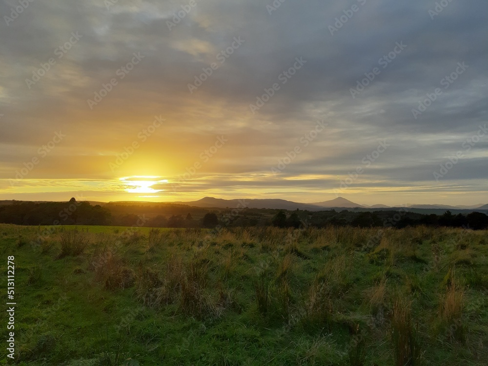 Obraz premium Sunset over Fields