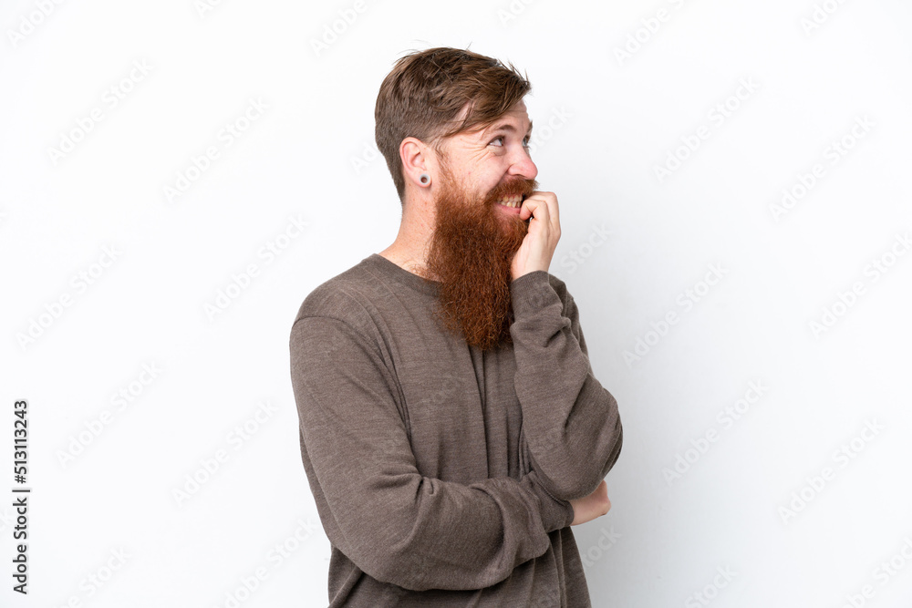 Redhead man with beard isolated on white background is a little bit nervous Redhead man with beard isolated on white background is a little bit nervous