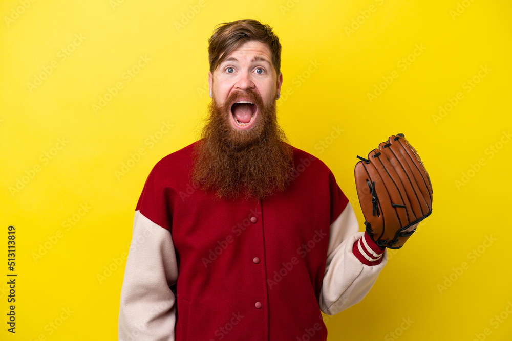 Redhead player man with beard with baseball glove isolated on yellow background with surprise facial expression Redhead player man with beard with baseball glove isolated on yellow background with surprise facial expression
