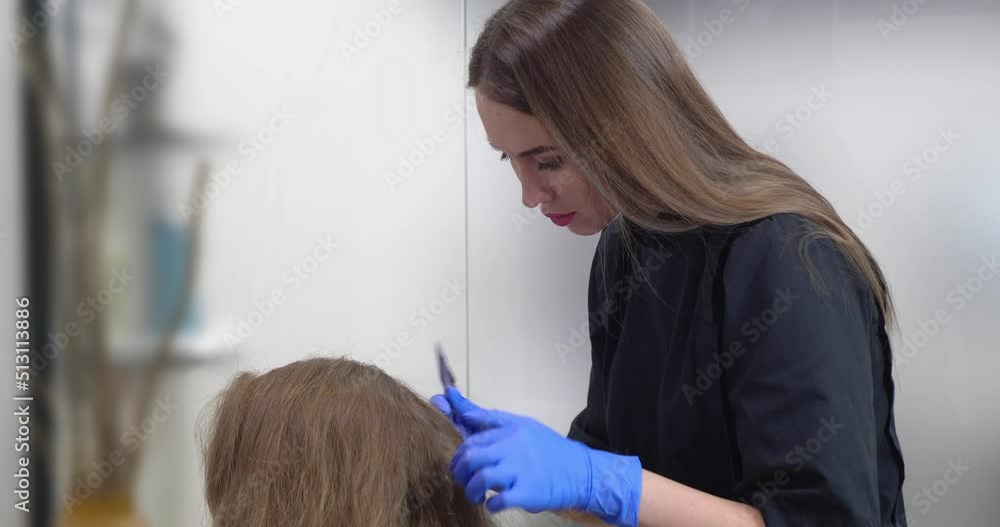 Young trichologist working with client at personal office Young trichologist working with client at personal office