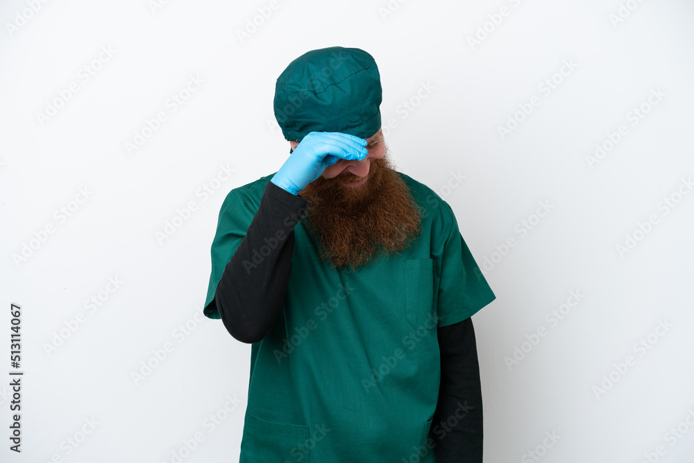 Surgeon redhead man in green uniform isolated on white background laughing Surgeon redhead man in green uniform isolated on white background laughing
