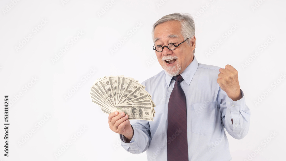 Business senior rich man Asian senior man , old man ,holding money US dollar bills in hand on white background , senior success business concept Business senior rich man Asian senior man , old man ,holding money US dollar bills in hand on white background , senior success business concept