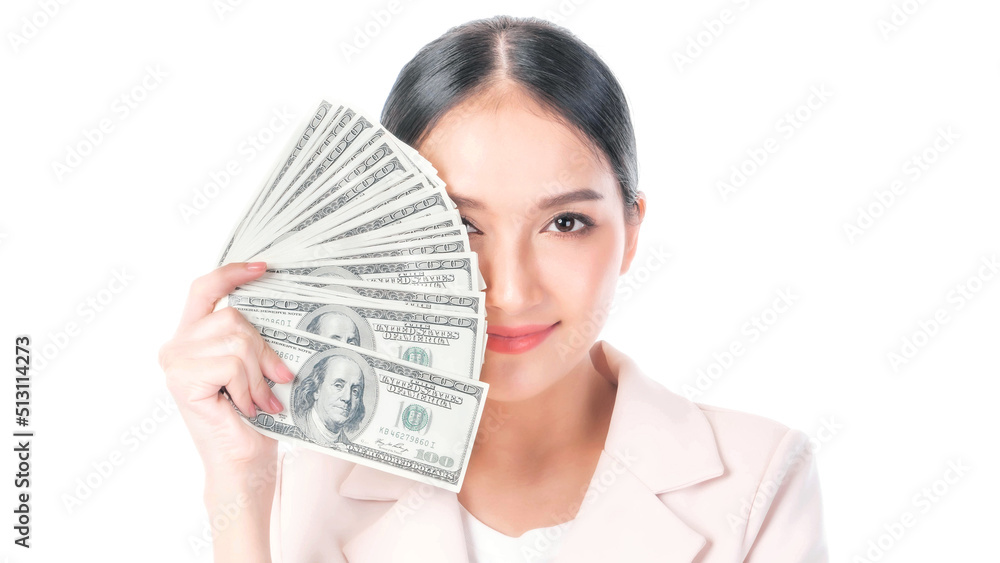 Successful beautiful Asian business young woman holding money US dollar bills in hand isolated on white background with copy space , business concept Successful beautiful Asian business young woman holding money US dollar bills in hand isolated on white background with copy space , business concept
