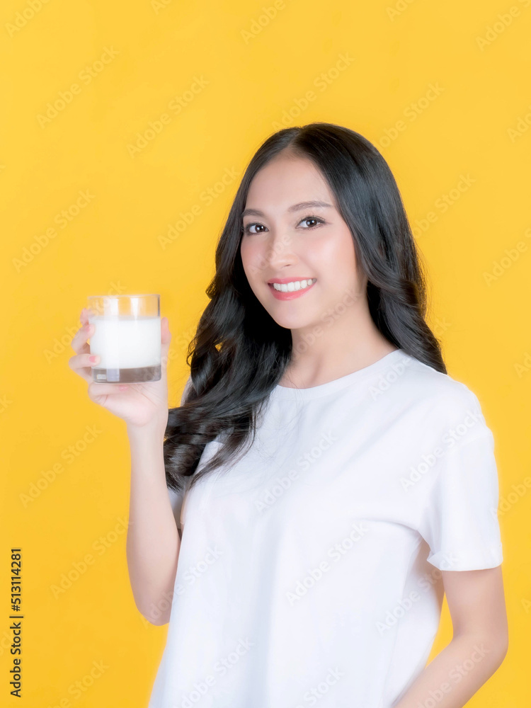 beauty woman Asian cute girl feel happy drinking milk for good health in the morning on yellow background - lifestyle beauty woman healthy concept beauty woman Asian cute girl feel happy drinking milk for good health in the morning on yellow background - lifestyle beauty woman healthy concept