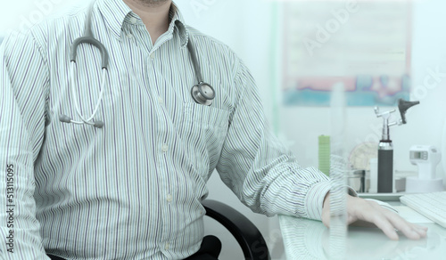 doctor person with stethoscpoe sits in hospital for diagnosis healthcare consult