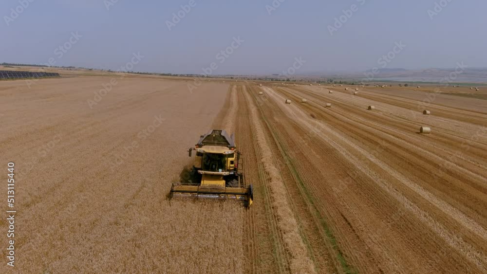 Aerial view of modern combine harvester collecting ripe wheat. Aerial view of modern combine harvester collecting ripe wheat.