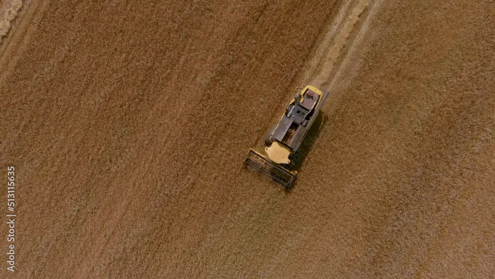 Aerial view of modern combine harvester collecting ripe wheat. Aerial view of modern combine harvester collecting ripe wheat.